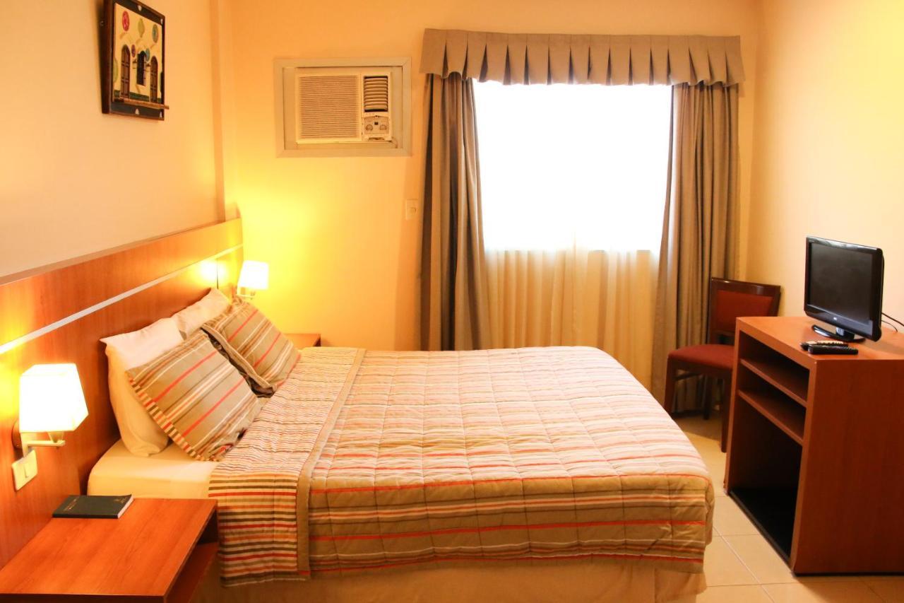 Olimpo Hotel & Suites Itaugua Bagian luar foto